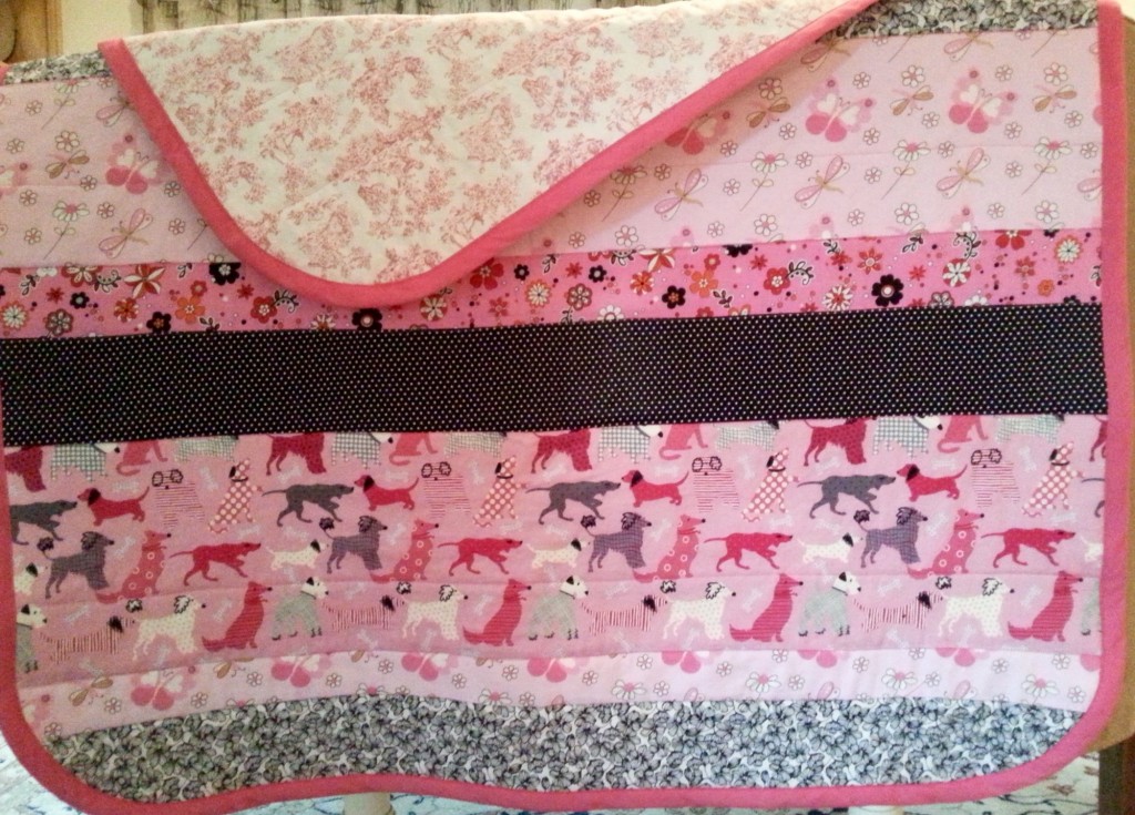 Quilt #2 - Totally love the pink black combo. Actually, the first fabrics selected were the pink flowers, and black/white polka dots. But my true love is the toile on back.  I would have toile in every room in my house if I could get away with it.